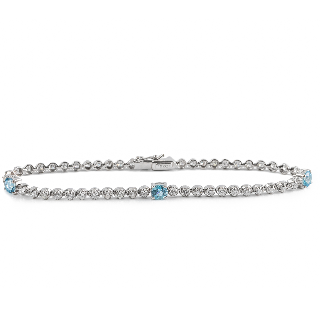 Pulseira ouro branco com brilhantes e topázio azul sky